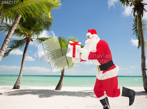 Image of man in costume of santa claus with gift box