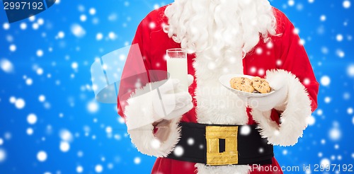 Image of close up of santa claus with milk and cookies