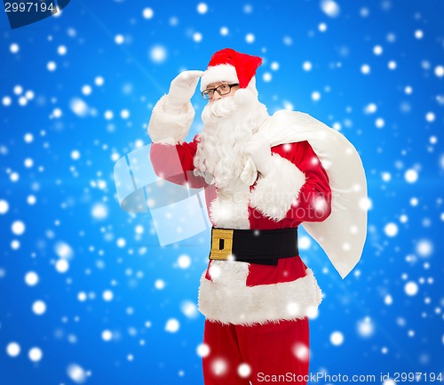 Image of man in costume of santa claus with bag