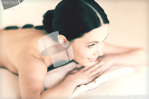 Image of woman in spa with hot stones