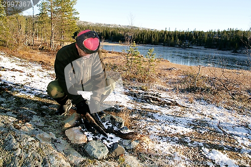 Image of Man making a fire