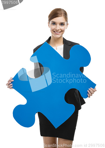 Image of Businesswoman with a puzzle piece