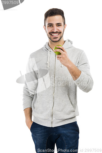 Image of Man tasting a green fresh apple