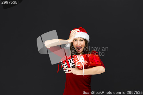 Image of Woman holding christmas gifts