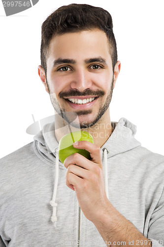 Image of Man tasting a green fresh apple