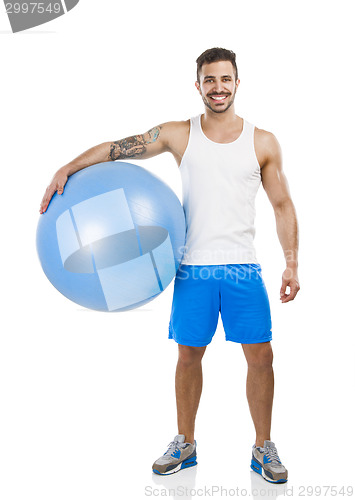 Image of Athletic man with a pillates ball