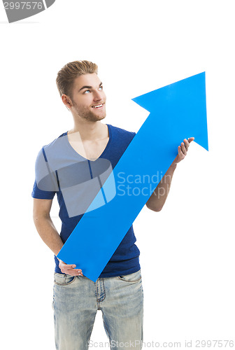 Image of Young man holding a blue arrow