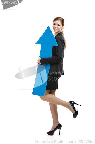 Image of Business woman holding a blue arrow