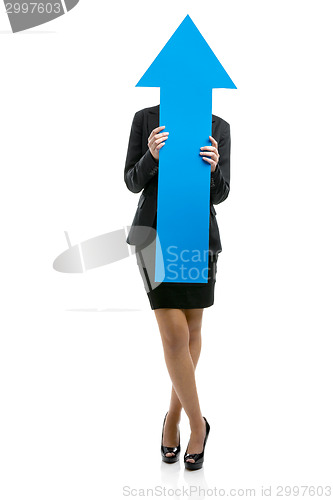 Image of Business woman holding a blue arrow