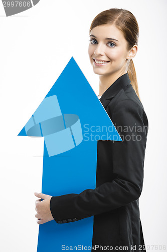Image of Business woman holding a blue arrow
