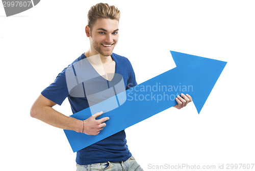 Image of Young man holding a blue arrow