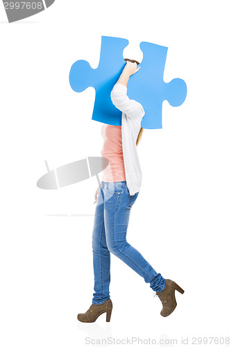 Image of Woman holding a puzzle