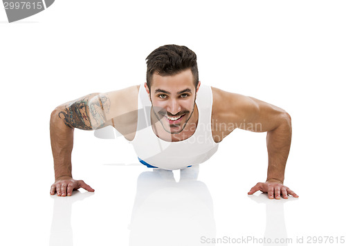 Image of Athletic man making pushups