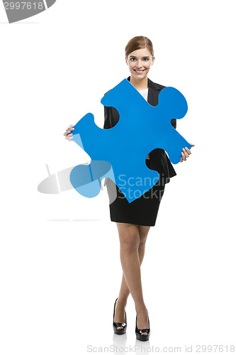 Image of Businesswoman with a puzzle piece