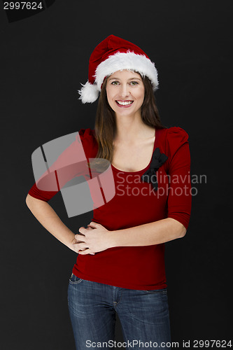 Image of Beautiful woman wearing a santa hat