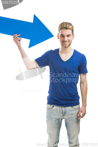 Image of Young man holding a blue arrow