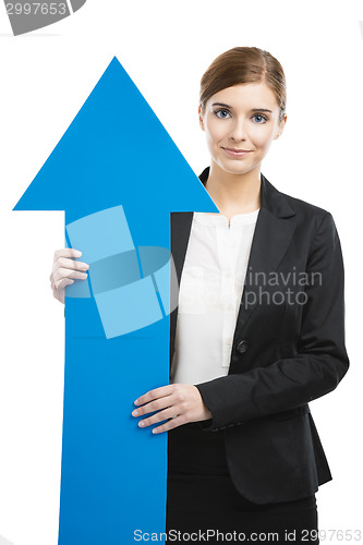 Image of Business woman holding a blue arrow