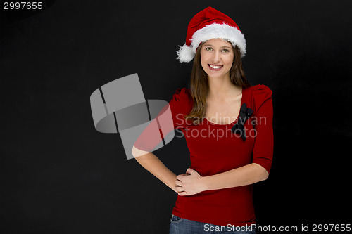 Image of Beautiful woman wearing a santa hat