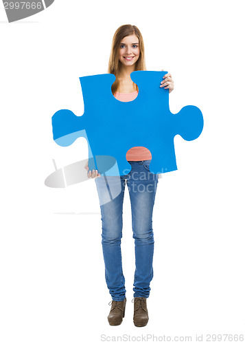 Image of Woman holding a puzzle