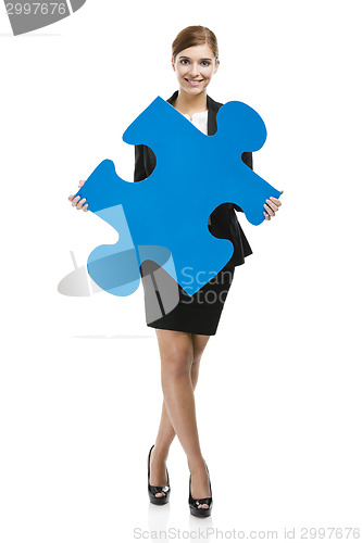 Image of Businesswoman with a puzzle piece