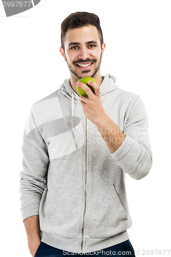 Image of Man tasting a green fresh apple