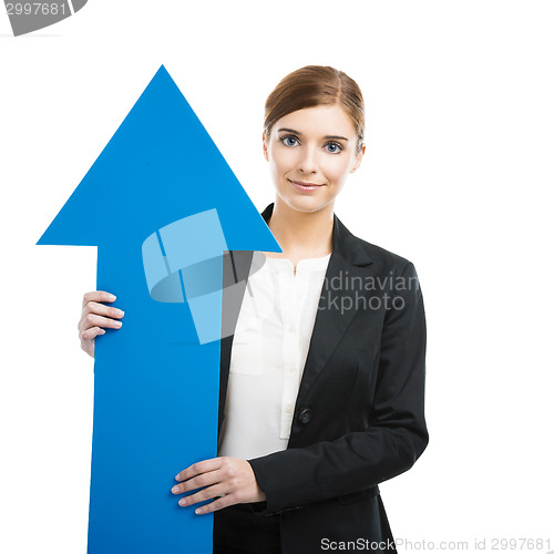 Image of Business woman holding a blue arrow