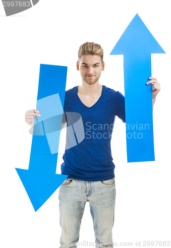 Image of Young man holding a blue arrow