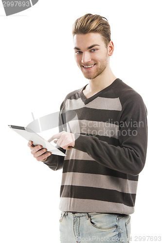 Image of Young man working with a tablet