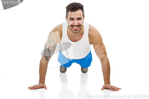 Image of Athletic man making pushups