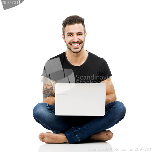 Image of Man working with a laptop