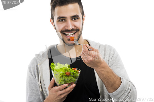 Image of Young man eating a salad