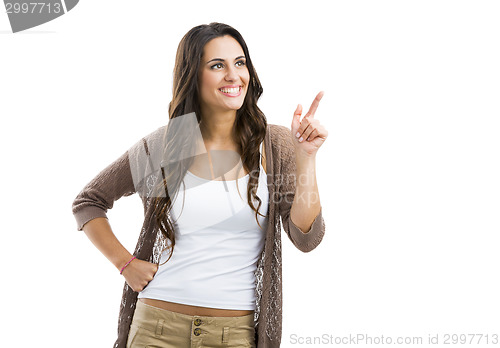 Image of Beautiful woman pointing to something