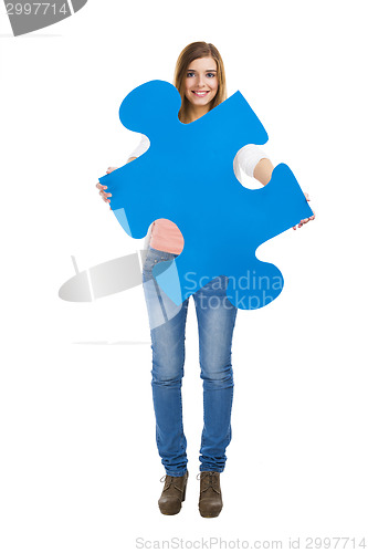 Image of Woman holding a puzzle