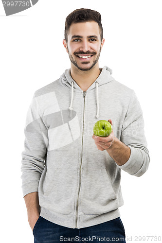 Image of Man tasting a green fresh apple