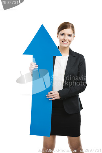 Image of Business woman holding a blue arrow