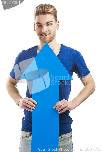 Image of Young man holding a blue arrow