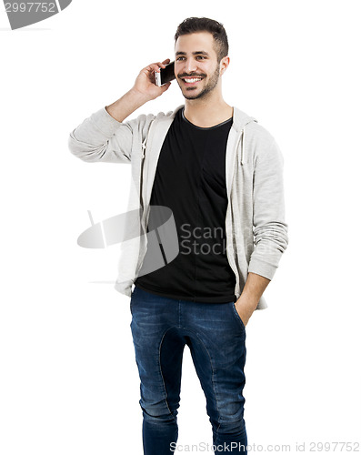 Image of Young man talking on cell phone