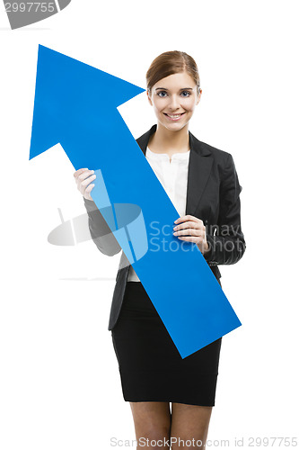 Image of Business woman holding a blue arrow