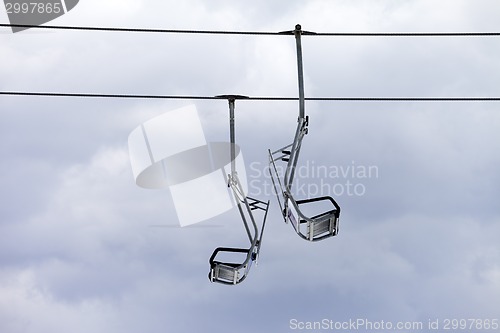 Image of Chair-lift and overcast sky