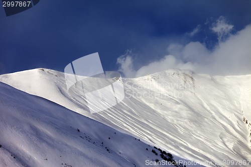 Image of Off-piste slope in sun evening