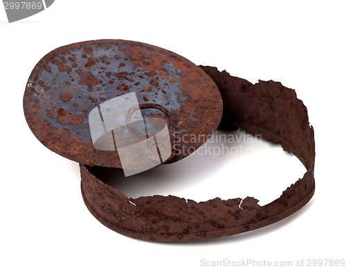 Image of Old rusty tin can on white background