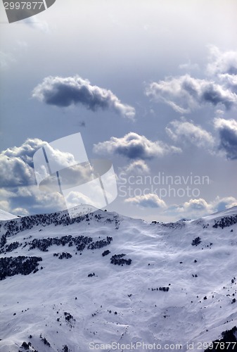Image of Off-piste slope and sunlight clouds