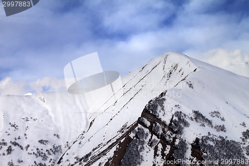 Image of Off-piste slope in morning and sky with clouds