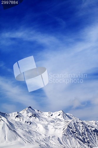 Image of Winter snowy mountains at windy day