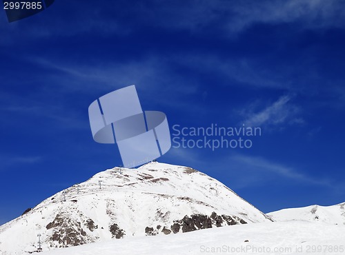 Image of Winter mountains and ski slope at sun day