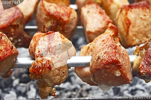 Image of Shish kebab on metal skewers close-up