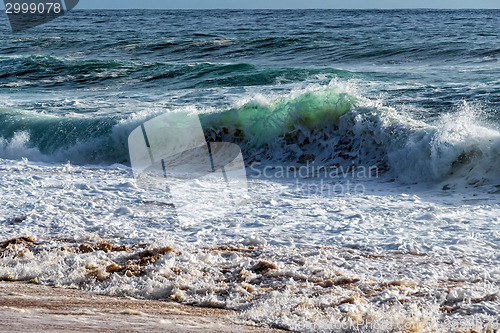 Image of Wave of the Sea on the Sand Beach