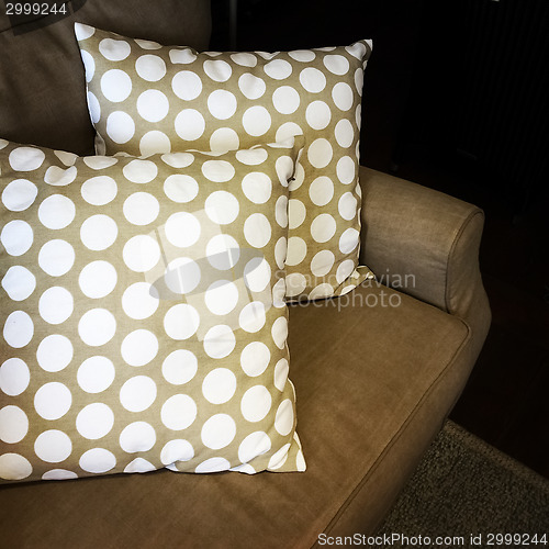 Image of Polka dot cushions decorating a sofa