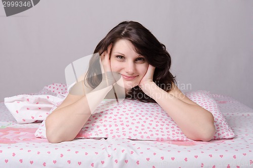 Image of Happy girl woke up in bed