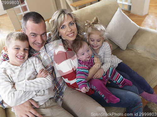 Image of happy young family at home